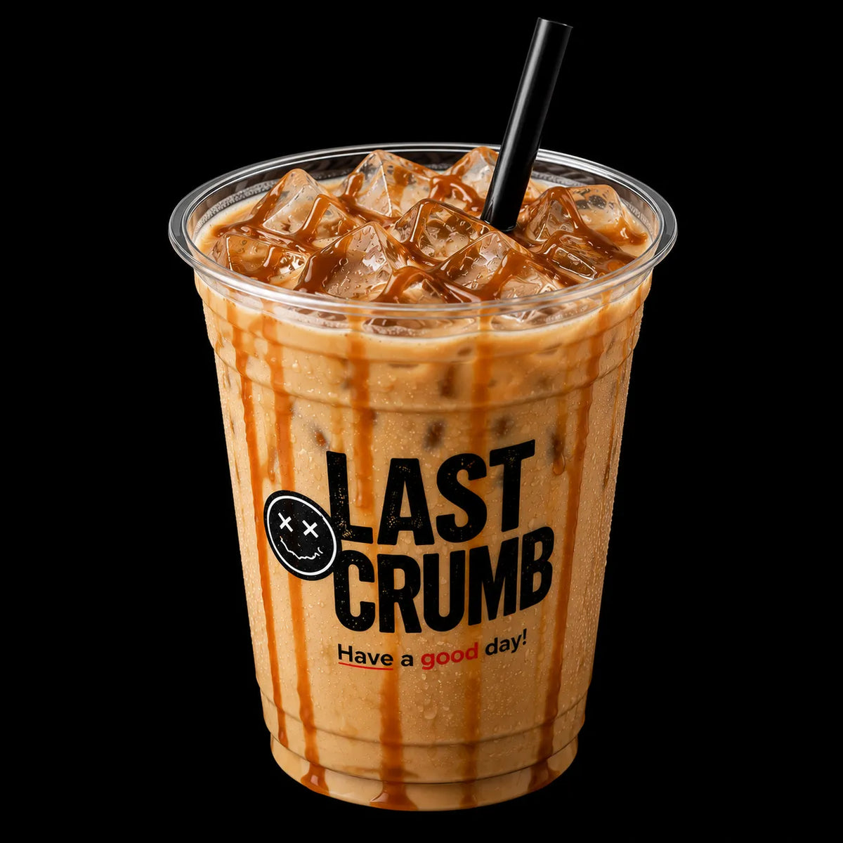 An iced coffee drink in a clear plastic cup with a black straw, featuring caramel drizzle and the Last Crumb logo on a solid black background.